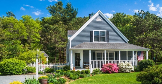 front view of house outside with greenery