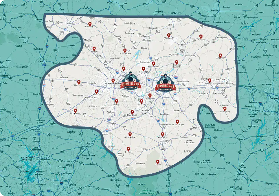 A map showing a service area in Georgia highlighted in white, with numerous red location pins and two central “Plumbing & A/C” logos. Surrounding areas are shown in teal.